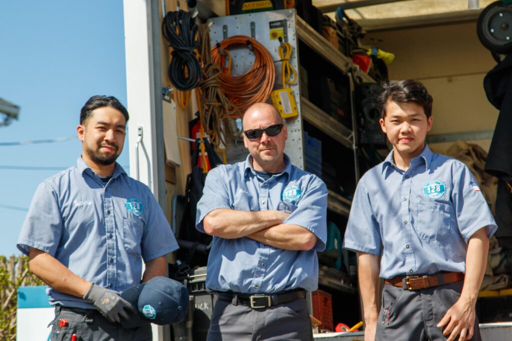 Technicians in front of truck